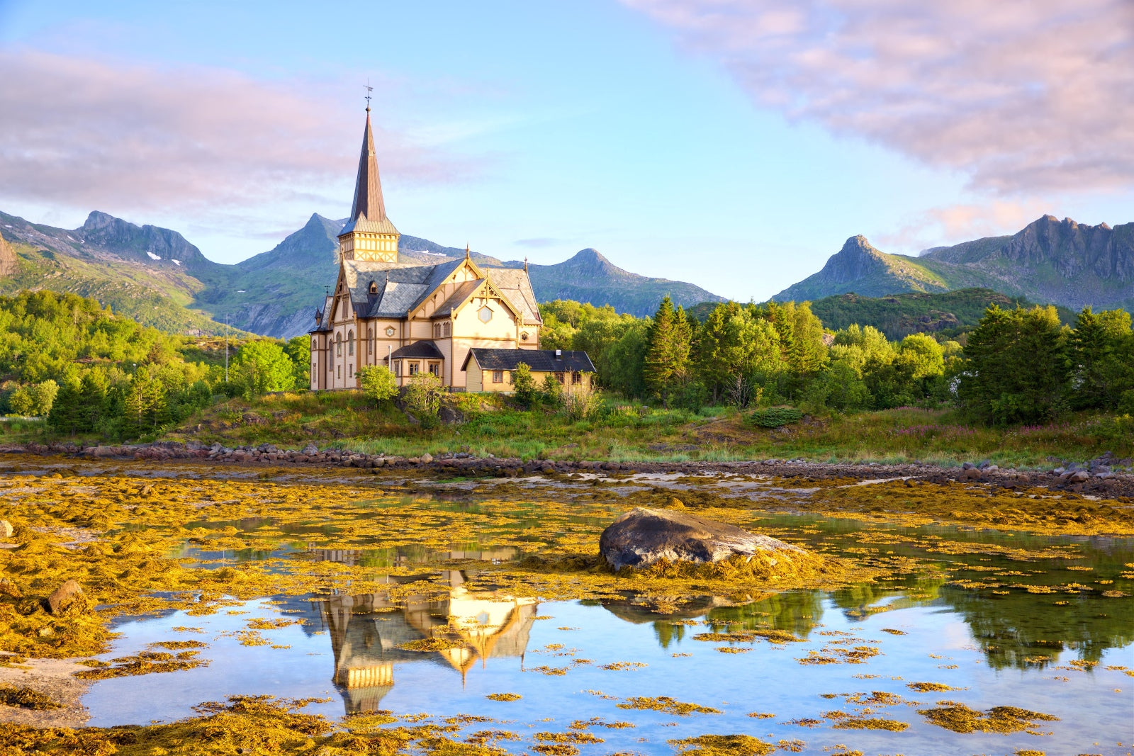 Church in a scenic landscape with mountains and water