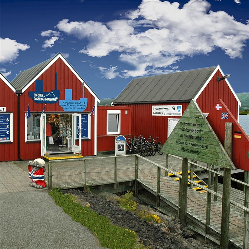 Red wooden buildings with writings on a clear day