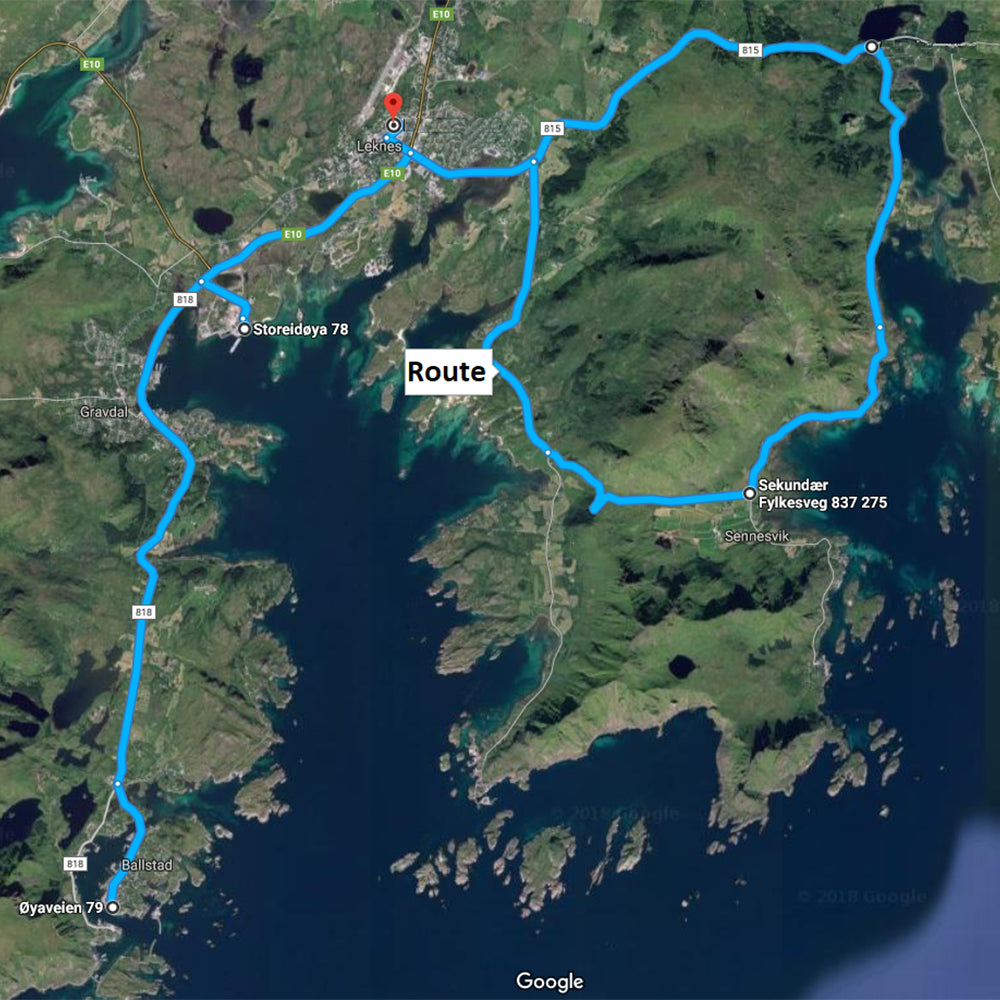 Map with a blue route line through a mountainous and coastal area.