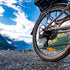 Close-up of a bicycle with a mountainous landscape in the background