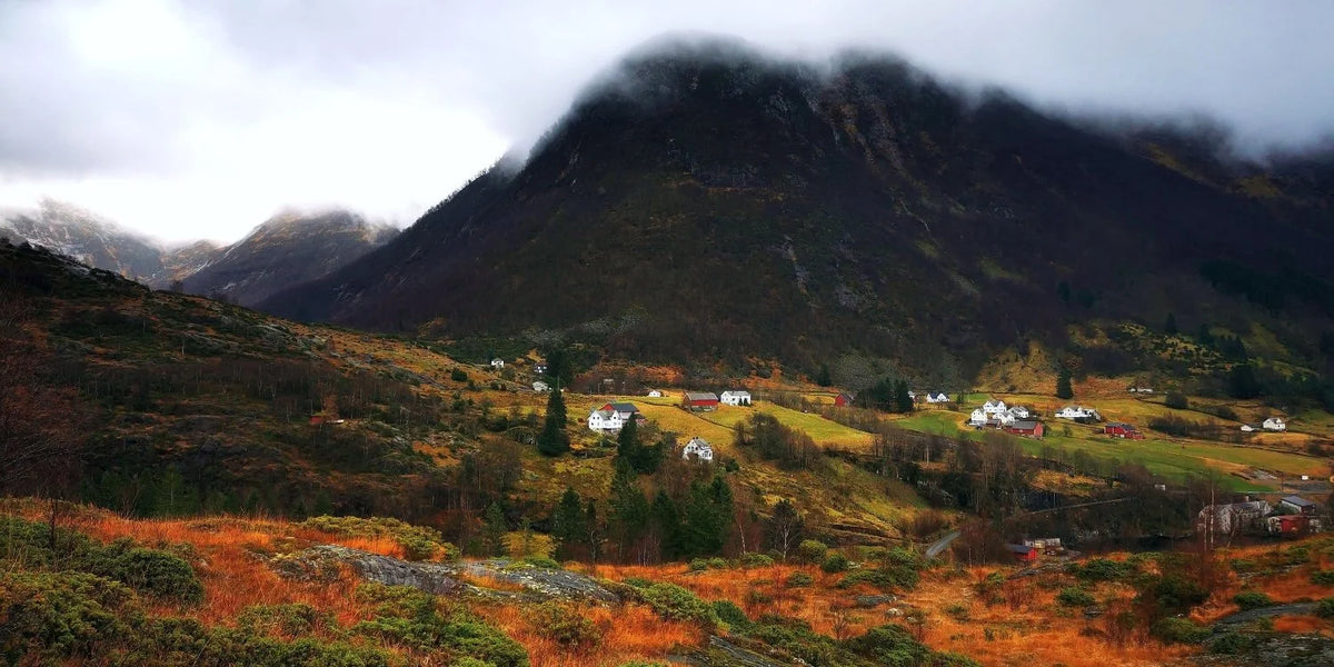 Scenic view of a mountainous landscape with a village in the valley.